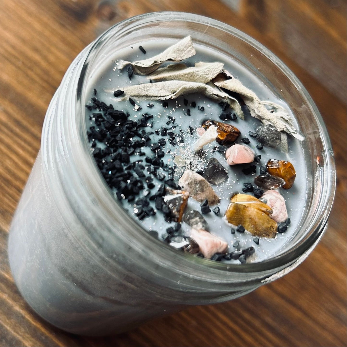 Silver goddess crystal candle with sage, black protection salt. tiger's eye crystals, and smokey quartz crystals.