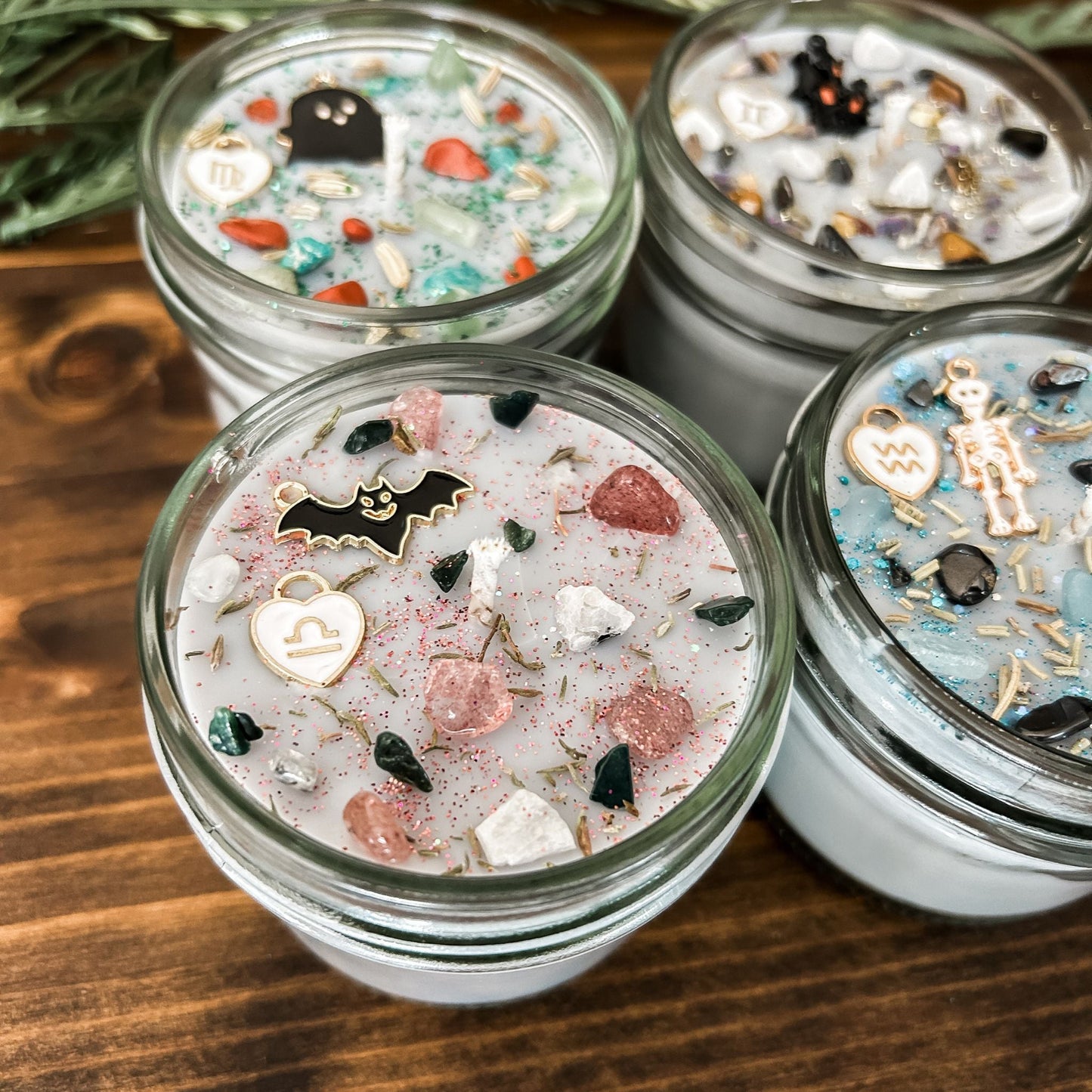 Spooky Libra Zodiac Candles with crystals, herbs, glitter, and a Halloween design.