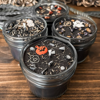 Spooky Libra Zodiac Candles with crystals, herbs, glitter, and a Halloween design.