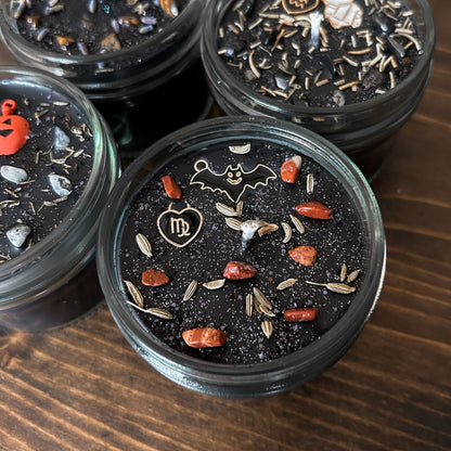Spooky Virgo Zodiac Candles with crystals, herbs, glitter, and a Halloween design.