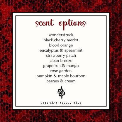 Scent Options include wonderstruck, black cherry merlot, blood orange, eucalyptus spearmint, strawberry patch, clean breeze, grapefruit mango, rose garden, pumpkin maple bourbon, berries and cream.

There is a red and black snakeskin border on the image.