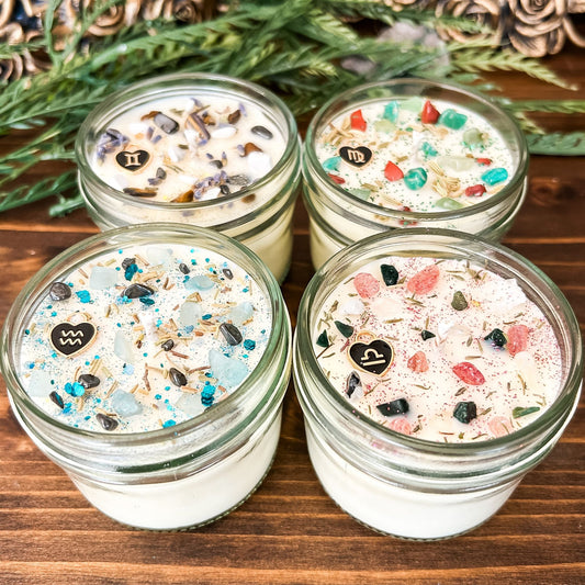 Zodiac Intention Candles with crystals, herbs, glitter, and a zodiac design.