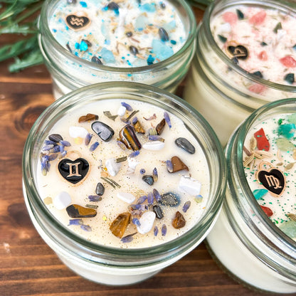 Gemini Zodiac Intention Candles with crystals, herbs, glitter, and a zodiac design.