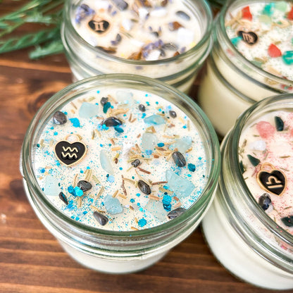 Aquarius Zodiac Intention Candles with crystals, herbs, glitter, and a zodiac design.
